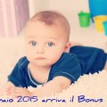 Cute baby boy lying on floor in room